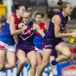 Fremantle clears the ball against Melbourne Demons during round 4 of AFLW 2024